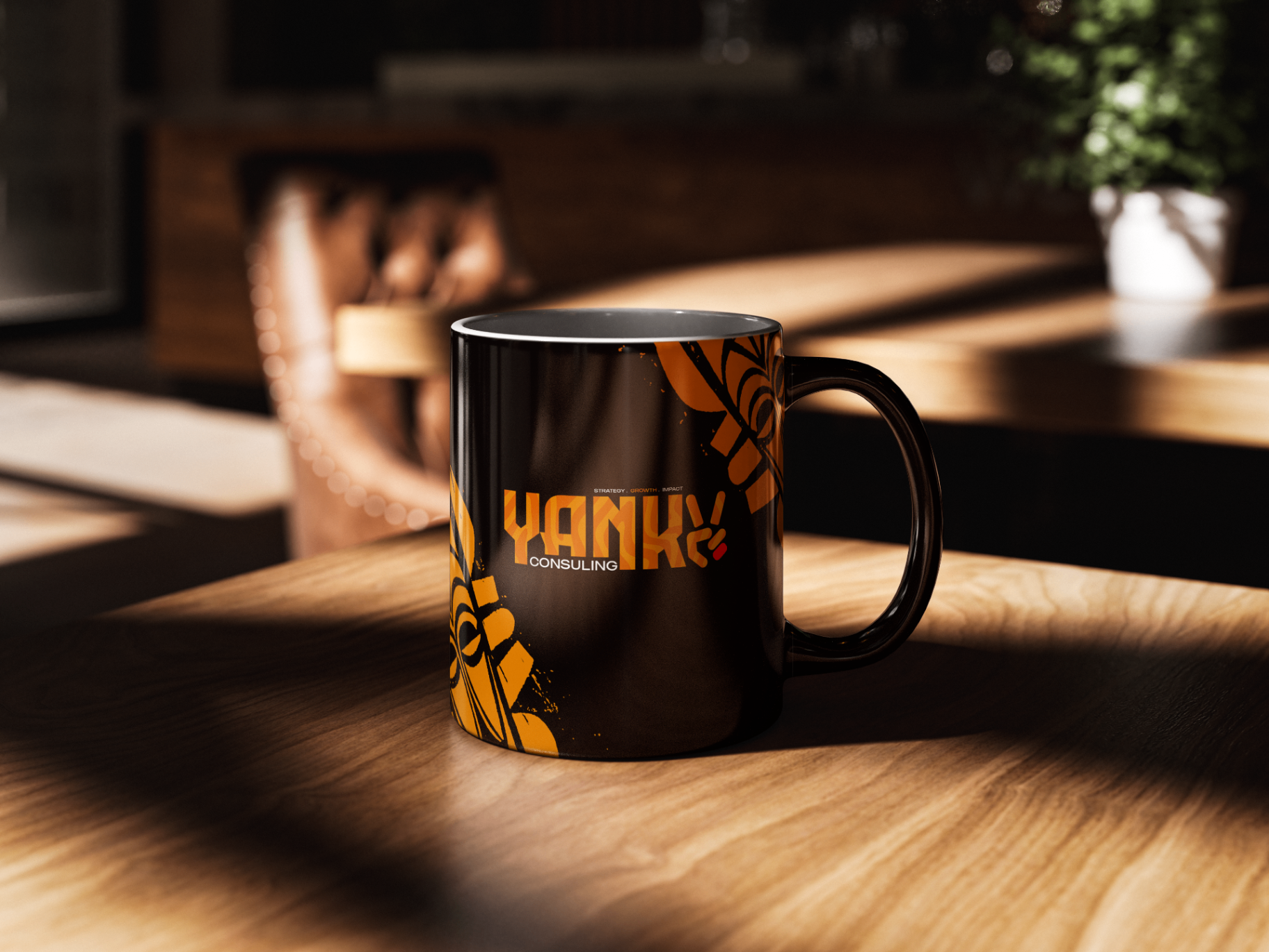 Tasse noire YANKY Consulting avec logotype orange et motifs graphiques